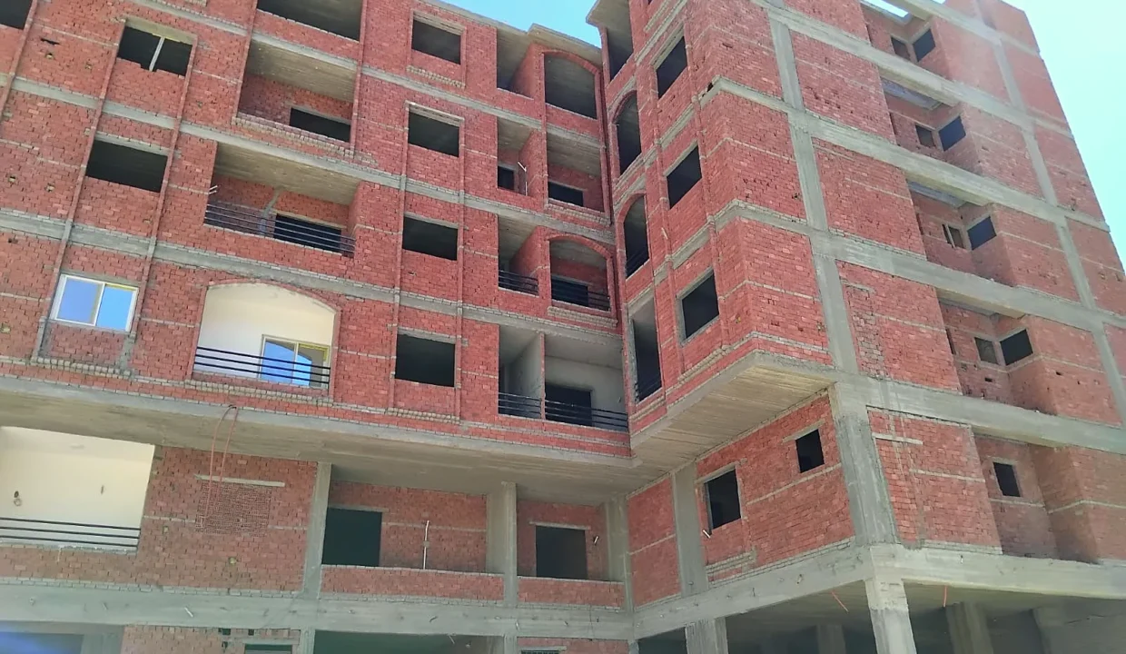 Hegaz Gate Hurghada facade under construction, brickwork and balconies — September 2026
